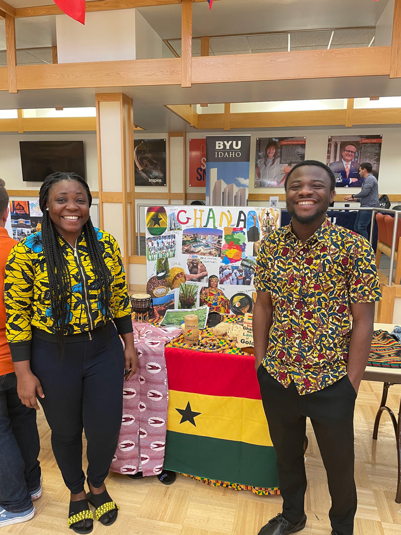 Student from Ghana posting for the photo infront of their country's booth